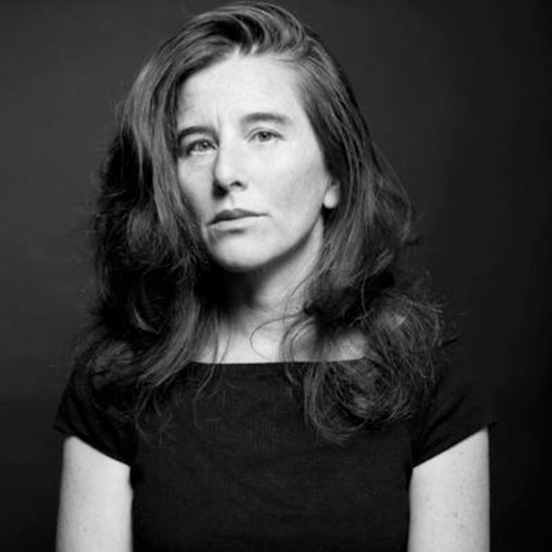 Black and white portrait of Fiona Tan, a Caucasian woman with long, voluminous hair wearing a dart top.jpg