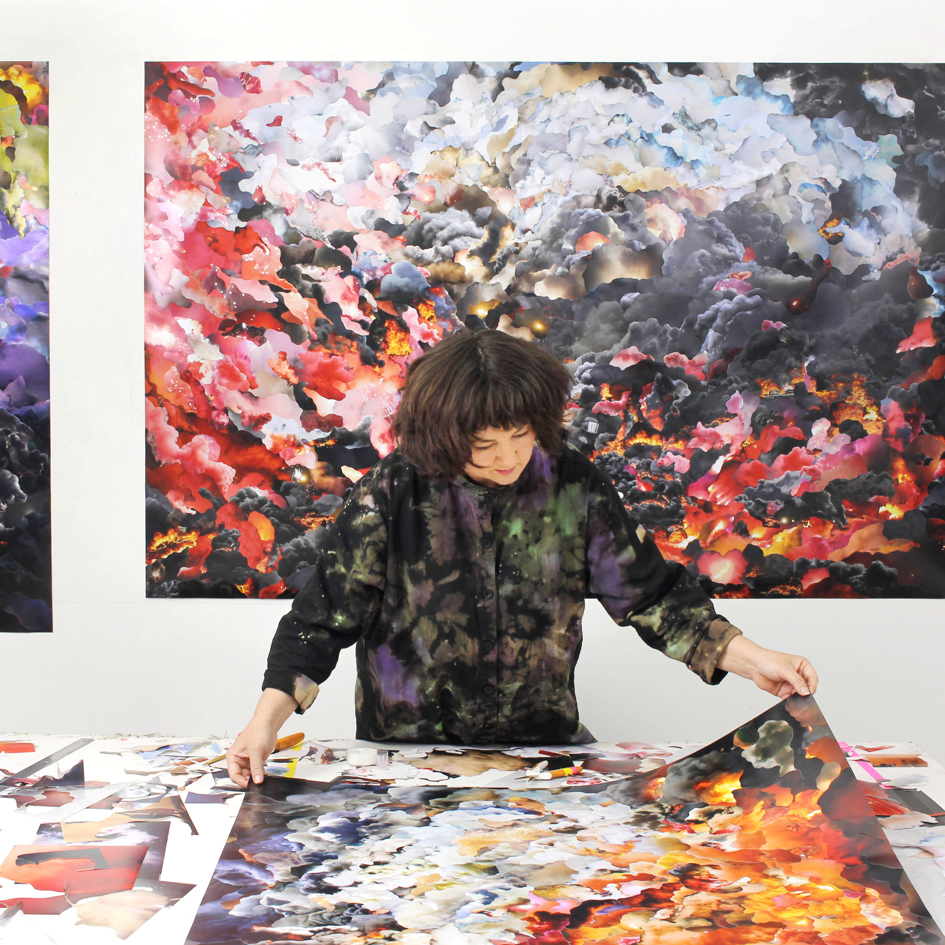 Jemima Wyman surrounded by her collage artworks in her studio
